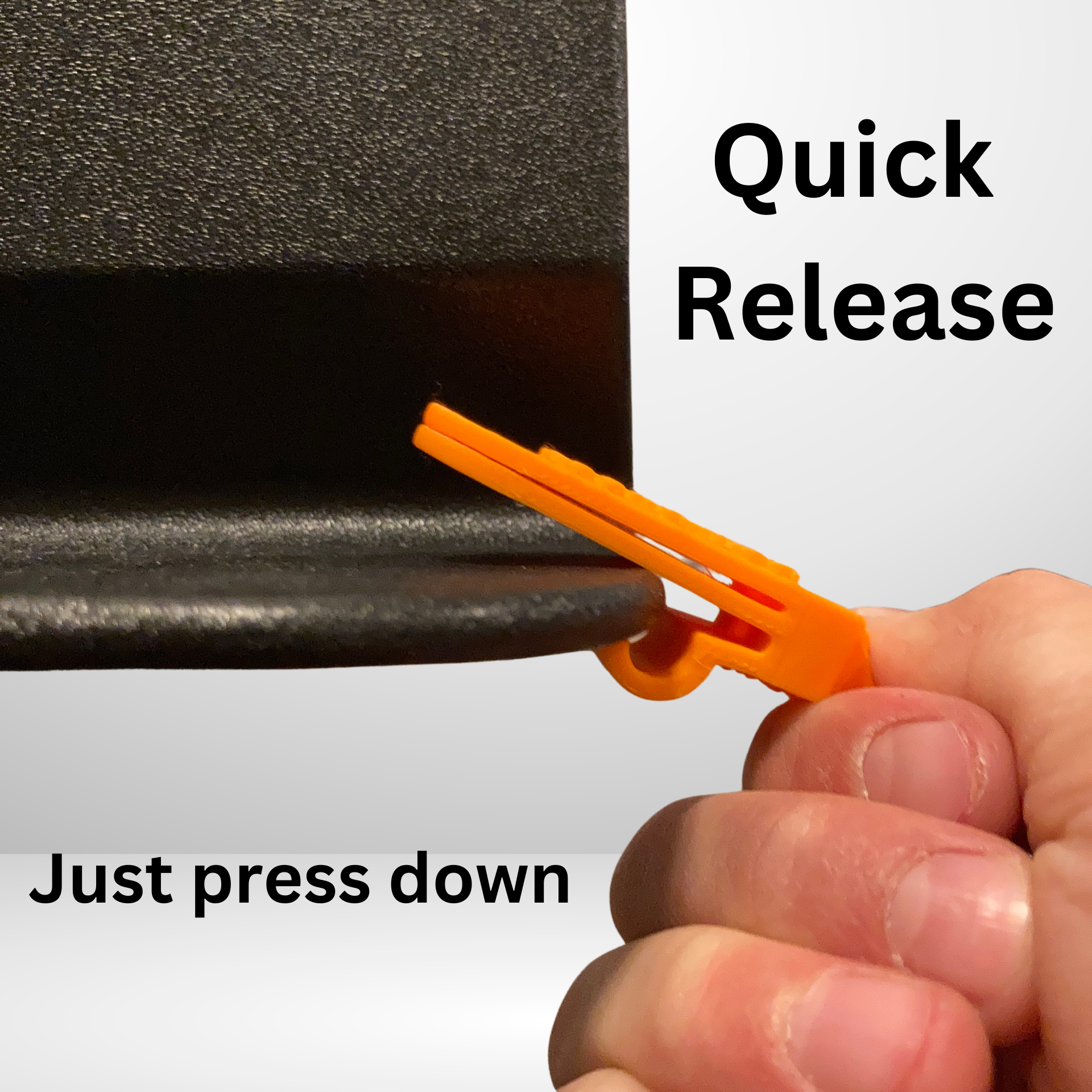 Orange Bow Buddy showing quick-release mechanism with press-down action